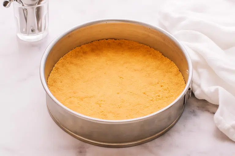 Philadelphia Cheesecake Filling Recipe: Creamy, Classic & Foolproof 7 Mixing graham cracker crust for cheesecake base