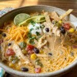 Creamy Chicken Tortilla Soup in bowl with tortilla strips